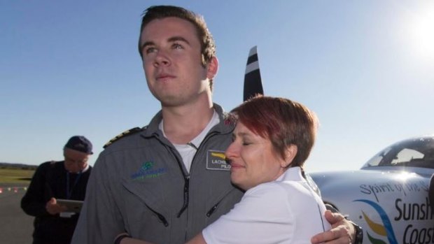 Lachlan Smart with his Mum Vanessa Sprague after becoming the youngest pilot to fly solo around the world.