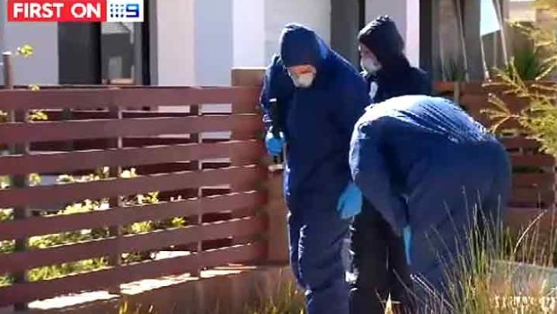 Forensic officers scouring the area in Champion Lakes on Thursday.