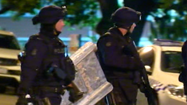 Police in full riot gear prepare to enter the Parkville youth centre. 