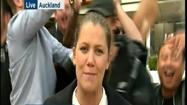 Jen Browning keeps her cool during a rowdy live cross from Auckland after Rugby World Cup.