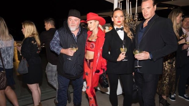 Kyle Sandilands and Imogen Anthony at the Double Bay launch of the new House of K'Dor jewellery boutique, with Simon Main far right.