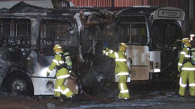 Firefighters assess the damages of the buses thought to be around $45,000