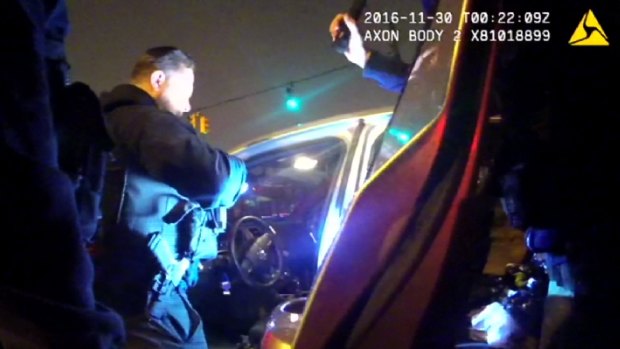 The police body camera videos were released by the lawyer of one of two people in the car who were arrested on drugs charges.