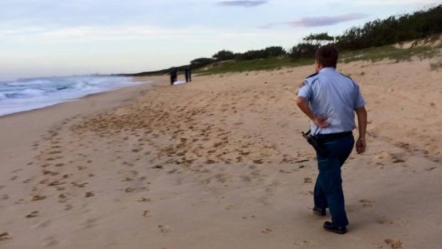 Police at the Warana beach where Steve Halgryn was found. 