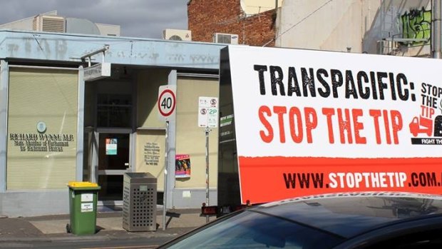 A professional billboard parked outside the electorate office of Planning Minister Richard Wynne. 