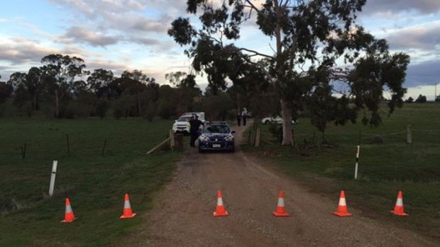 Police at the Hillier property where a woman and two children were found dead on Monday afternoon.