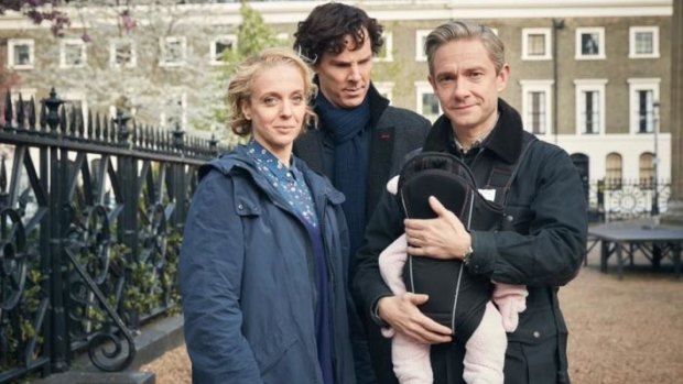 Happy families: The Watsons with their newest edition, and Sherlock is looking so pleased for them.