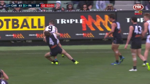 Carlton's Bryce Gibbs was banned for this tackle on Port Adelaide's Robbie Gray in June.