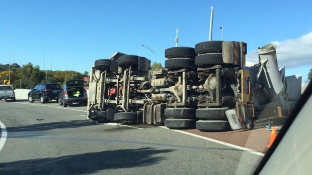 The truck rolled over on the off ramp of Roe Highway coming onto Great Eastern Highway on Monday morning.
