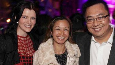 Amber Harrison, left, with former boss Nick Chan and his wife Peggy.