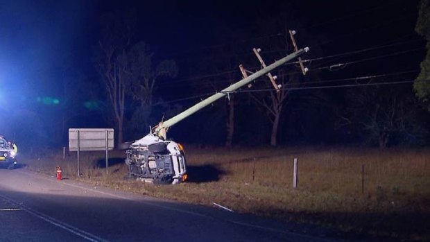 The force of the crash snapped the power pole in half. 