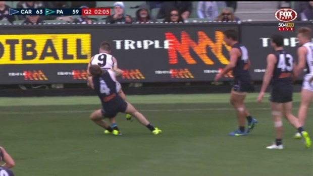 Carlton's Bryce Gibbs was banned for this tackle on Port Adelaide's Robbie Gray.