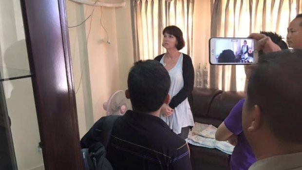 Tammy Davis-Charles being questioned in the Cambodian police office of human trafficking last year.