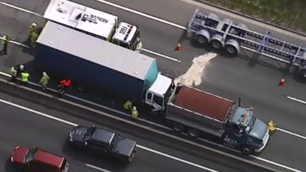 A truck rammed into the back of another truck on the Pacific Motorway