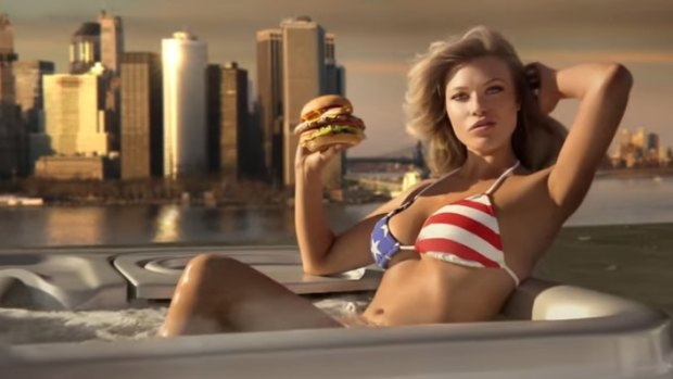 Sports Illustrated model Samantha Hoopes, in a hot tub, advertises the Most American Thickburger.