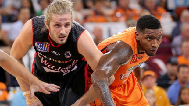 At close quarters: Perth's Jesse Wagstaff and Cairns import Torrey Craig.