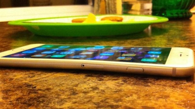 MacRumors user DevinPitcher shows off a bent iPhone.