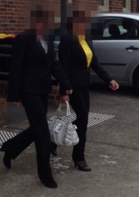 "Betty Colt" in the yellow shirt outside court. She is accompanied by her daughter  "Raelene".