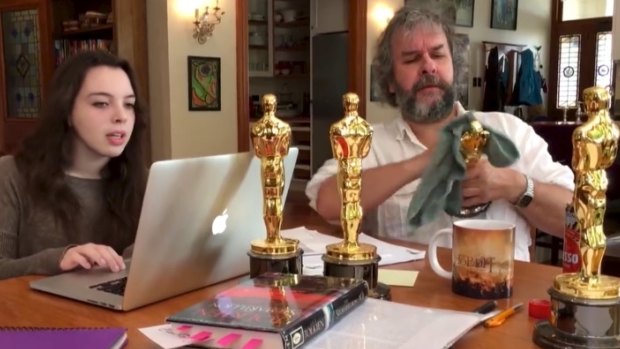 Shining example ... Peter Jackson gets down and dirty polishing his Oscars.