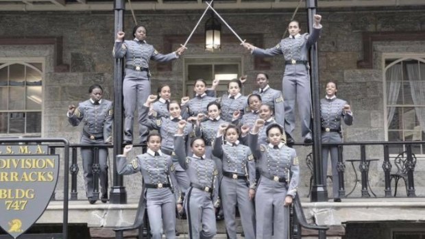 Controversial gesture: Sixteen black, female cadets in uniform with their fists raised..