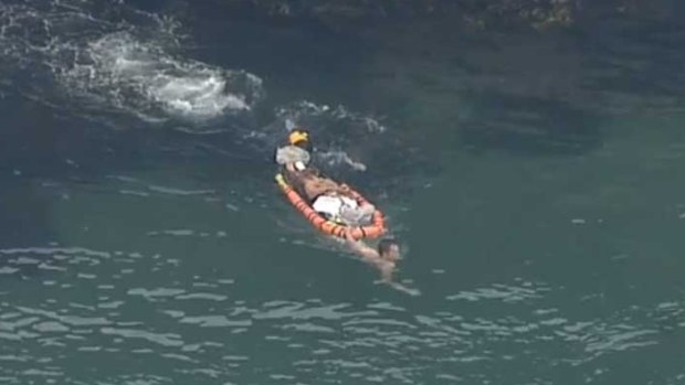 A teenage girl being taken for medical treatment after falling from a cliff in Sydney's east.