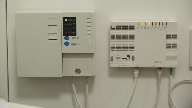 The NBN power supply unit with a back-up battery, left, that is causing headaches.