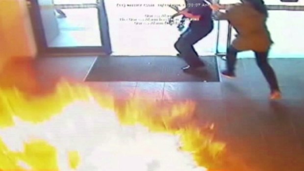 People flee the fireball in the Springvale Commonwealth bank.