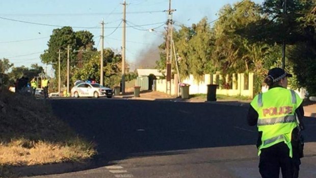 A police officer stands guard near the scene of an explosion in the Mount Isa suburb of Mornington.