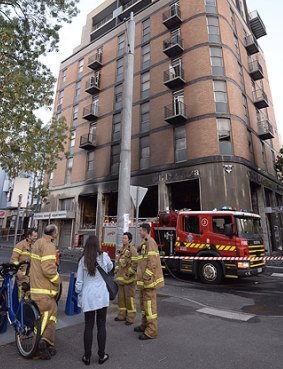 Firefighters evacuated a building hit by a blaze in a ground floor shop.