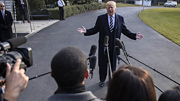 Donald Trump speaks to reporters on Saturday fresh off a victory in the Senate that puts him a step closer to passing a tax-cut bill.