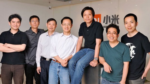 Lei Jun, founder, chairman and CEO of Xiaomi (seated) with his seven co-founders.