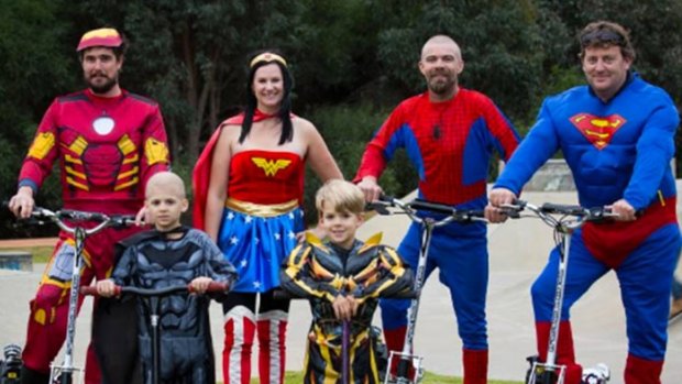 Mathew Ralston (back left) and Warren Hancock (right) with the Kane family; Declan, Brodie Kim and Simon, are raising awareness about childhood cancer.