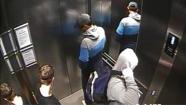 The two men captured by CCTV in a lift in Zetland.