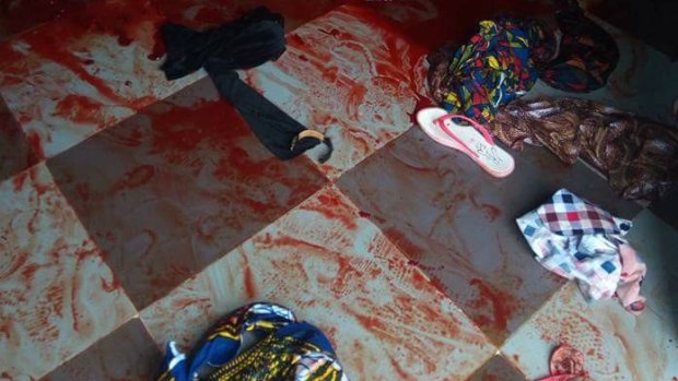 Bloody scene at the Catholic church in Ozubulu, Nigeria, after 11 people were shot dead.