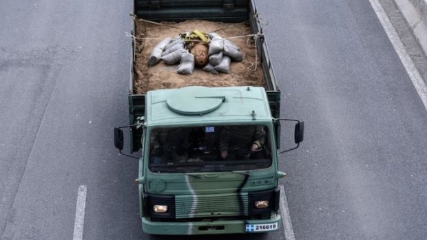 Bomb carried away by Greek military vehicle.