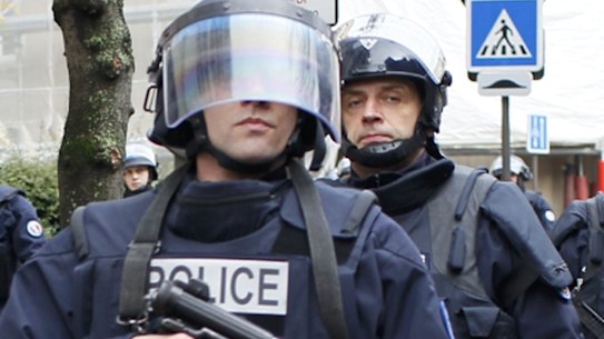French SWAT police surround the supermarket in east Paris before the assault.