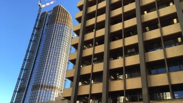 The old and the new of Queensland's public sector - 1 William Street (left) and the soon-to-be demolished Executive Building. Staff are set to move in from October 21. 