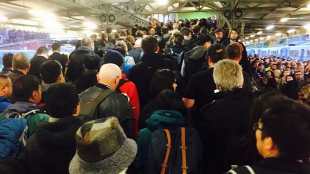 Peak-hour commuters at Camberwell station head to buses after the double fatal crash at Surrey Hills.