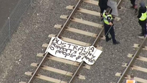 The banner left by protesters on the tracks.