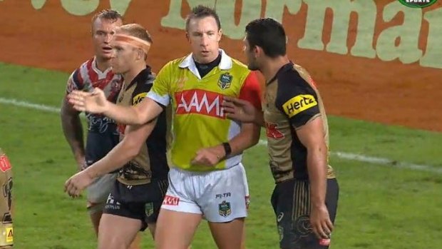Hands on: Sam McKendry touches referee Jared Maxwell during the Panthers' win against the Sydney Roosters on Monday night.