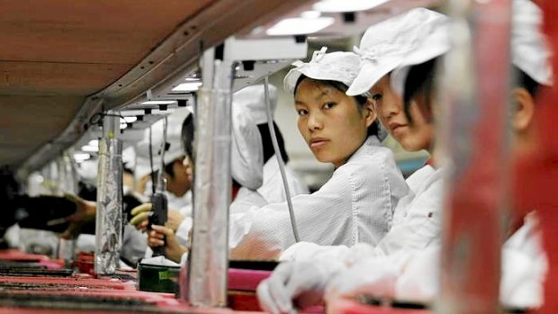 Workers are seen inside a Foxconn factory in Longhua, China in 2010. Foxconn, a major supplier of Apple was said to be improving workplace conditions.