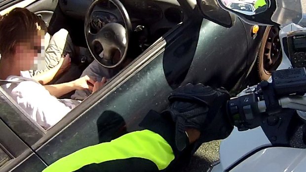 This Perth driver allegedly rolled a joint in front of a motorbike cop.