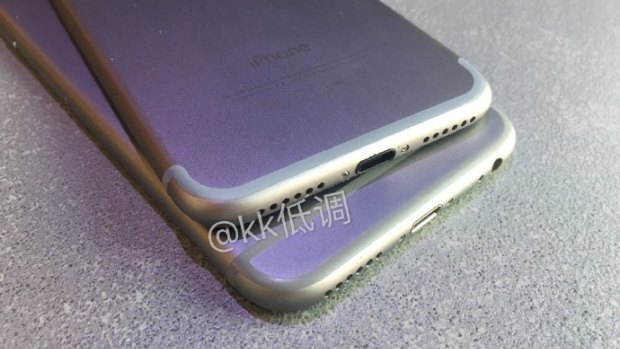 A seperate image, also posted online in July, shows a slightly different iPhone, with no headphone jack, sitting on top of an iPhone 6S.