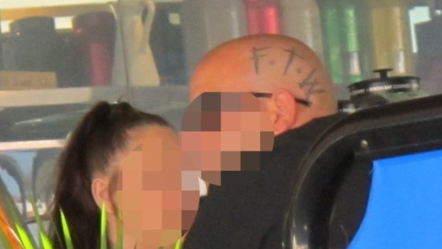 A man with a FTW head tattoo.