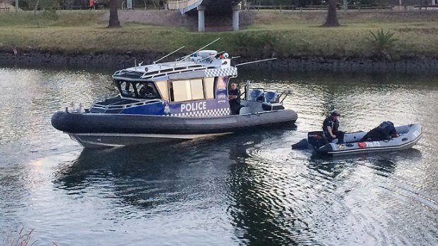 Police search the Maribyrnong River.