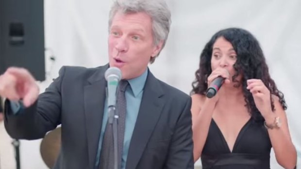 Jon Bon Jovi takes the stage in a viral wedding video.