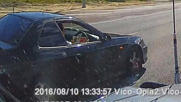 This driver was caught reading a catalogue while driving along the Mitchell Freeway in August.