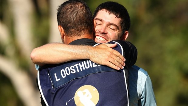 Louis Oosthuizen celebrates winning the Perth International with his caddy.