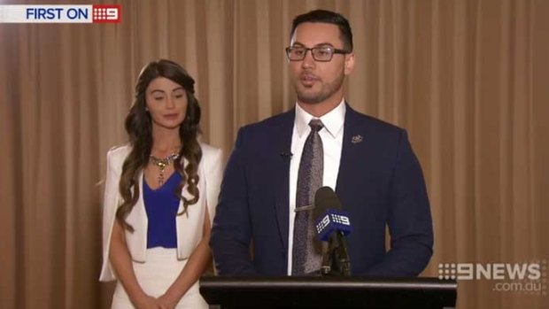 Salim Mehajer at a lectern, with his wife Aysha beside him, during an interview with Nine News in 2015.