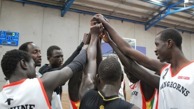 Team effort: ‘Manny’ Berberi, far left, and Mangok Mathiang, number seven.